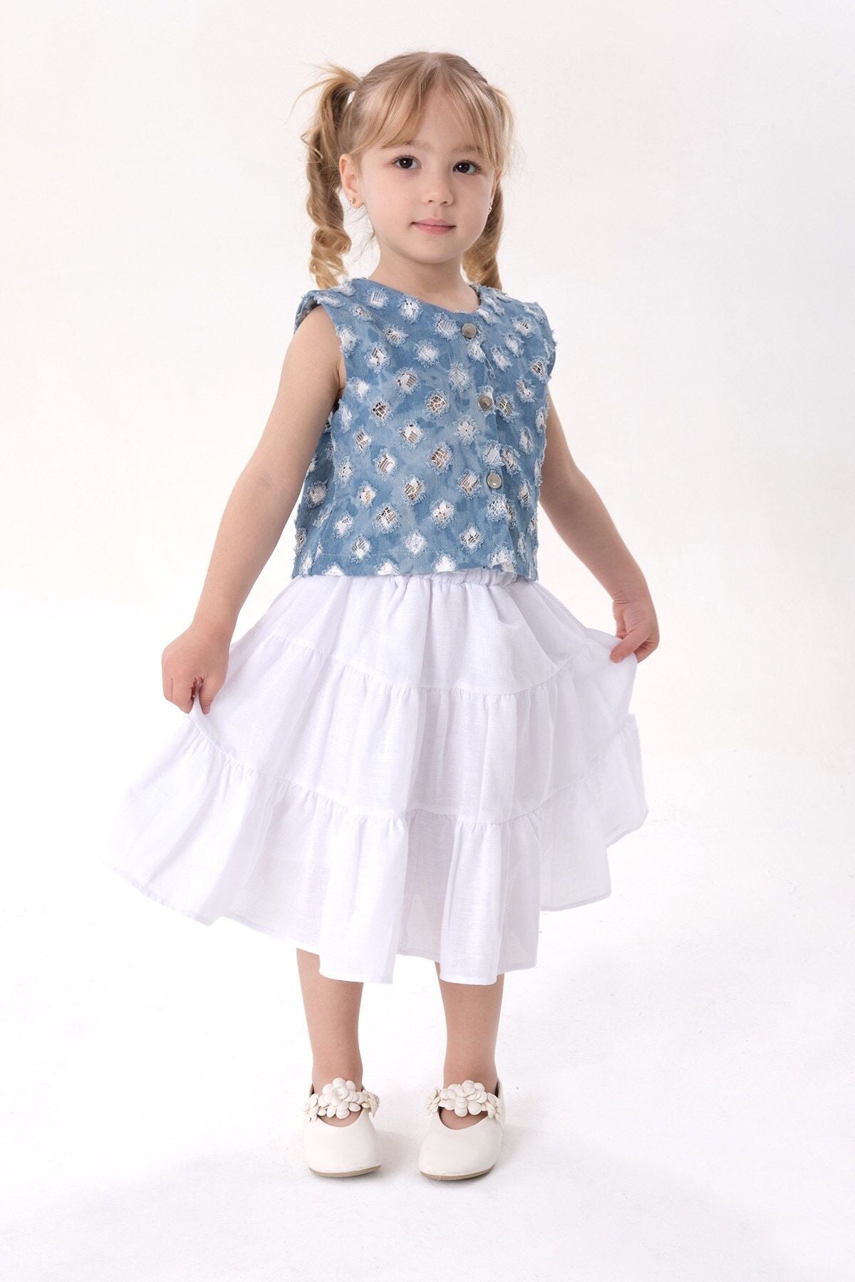 Mavi denim yelekli etekli takım